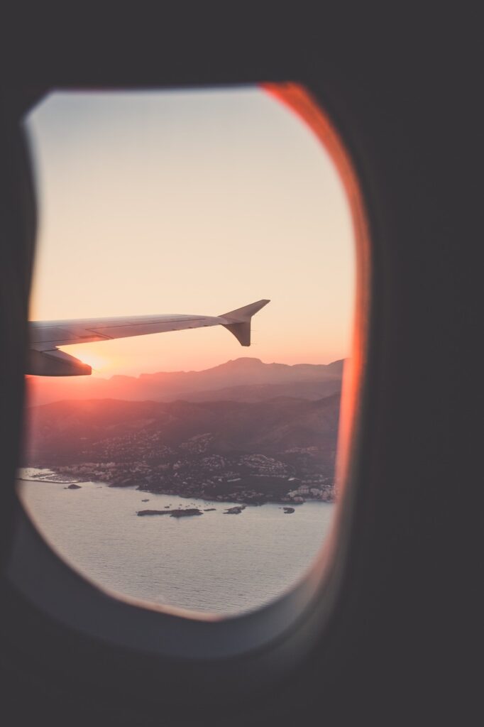 window, airplane, travel, trip, sky, sea, mountain, sunrise, sunset, gray sunset, gray sunrise, gray window, nature, gray plane, gray airplane